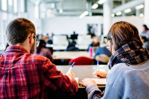 students in seminar taking notes