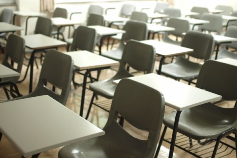 rows of chairs and desks in a classroom