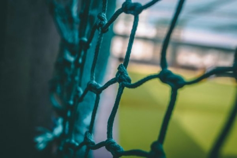 A close up photo of a football goal net