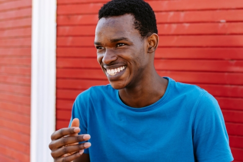 International student Omer is laughing