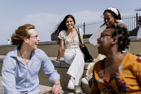 International students are chatting and laughing outdoors