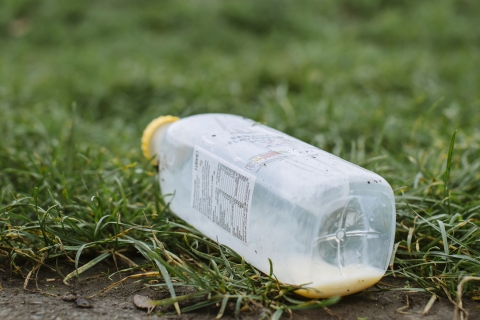 Clear plastic bottle on the ground.