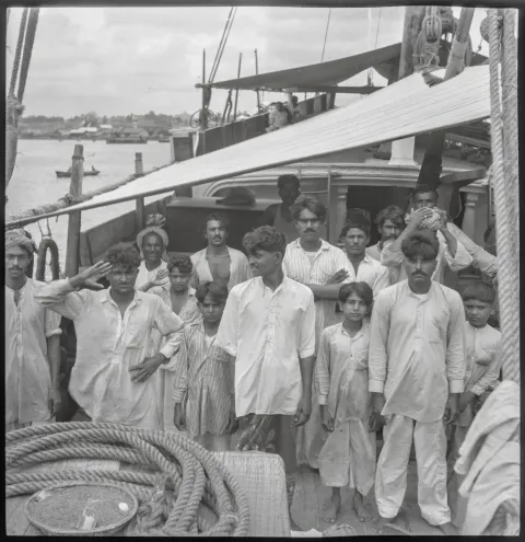 The captain and crew on board the Indian kotia type dhow Karimi (fl.1938) anchored at Colombo, Ceylon (by David Watkin Waters) P34317. Copyright: National Maritime Museum, Greenwich, London