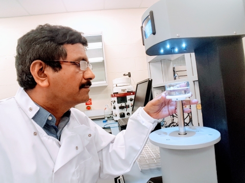 Pat Rahman investigating petri dish