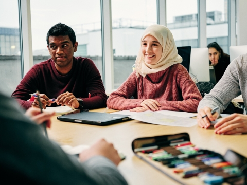People sat around a table 