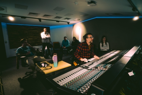 7 people in a music studio