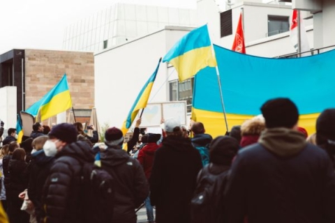 A peaceful protest with people holding Ukraine flags