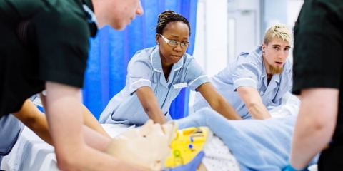 Paramedic and students nurses working in simulation ward.
