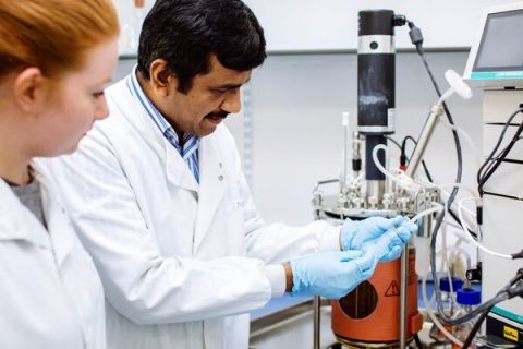 Dr Pattanathu Rahman working in his lab with female researcher