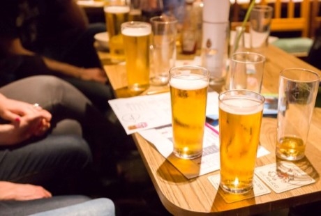 beer glasses on a table in a bar