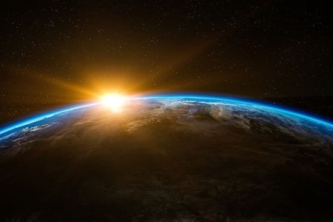 A picture of the Earth and the sun