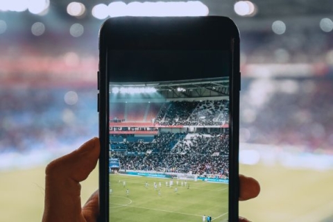 A smart phone recording a football game 