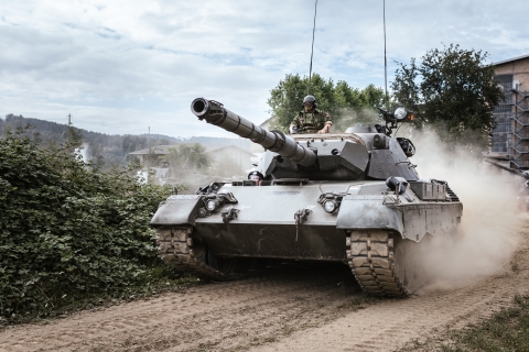 Military tank with soldiers - Photo by Kevin Schmid on Unsplash 