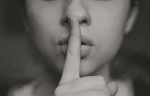 Picture of woman with finger on her lips
