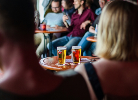 unsplash image people in pub with pints