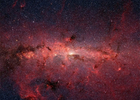 An image taken by the NASA Spitzer Space Telescope of the swirling core of our spiral Milkyway galaxy Image Credit NASA JPL Caltech
