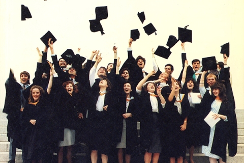 Graduates throwing their caps, the same photo used on our 1990 prospectus