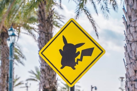 Yellow traffic sign with black shadow of Pikachu - Photo by Roméo A. on Unsplash