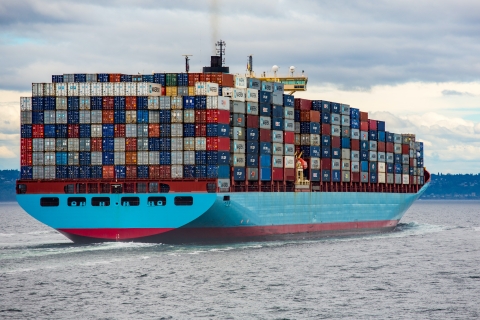 cargo ship loaded with cargo containers on its way