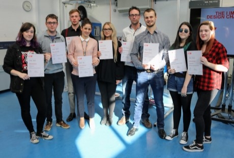 University of portsmouth engineering students pose for a photograph holding up their certificates