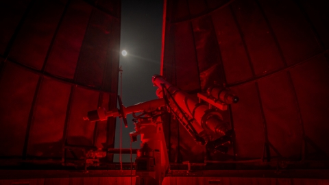 A telescope looking out into the night sky