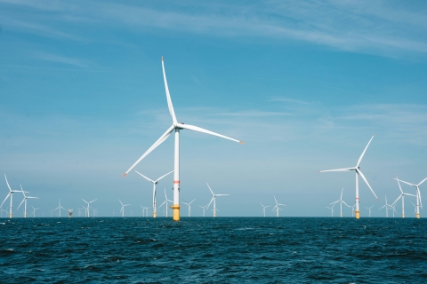 Image of wind turbines out in the sea, offshore