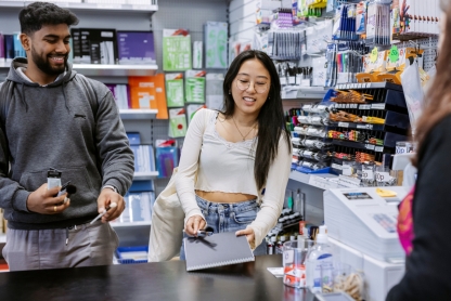 Two students shopping inside the Art Supplies shop at the Eldon Building