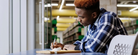 University of Portsmouth student in the library