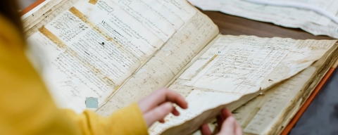 History student examines historical record. BA (Hons) History.