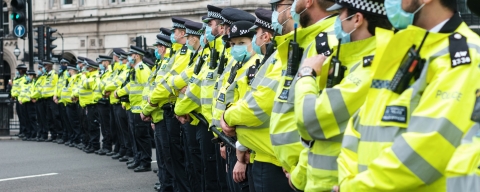 Police officers in a line up with face masks on