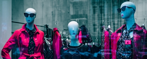 Mannequins in clothing in a store window