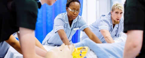 Student nurses treating patient