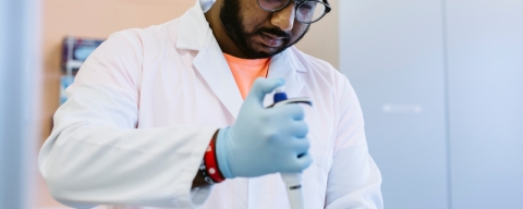 A student working in the Biochemistry and Biology lab