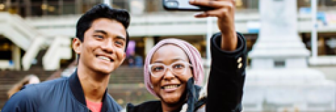 two students smiling for a selfie