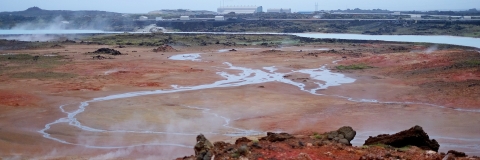 Red and orange geothermal area with hot springs