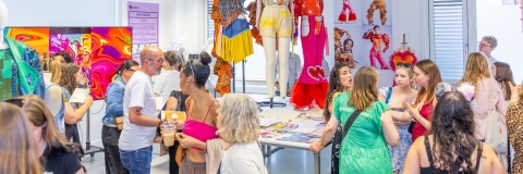people in the fashion studio attending the 2025 graduate showcase