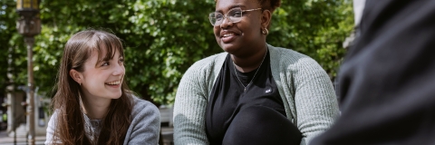 Three people laughing together 