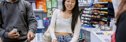 Two students shopping inside the Art Supplies shop at the Eldon Building