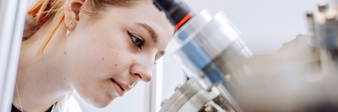 Student conducting observation on device in Technology Facilities