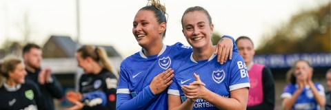 Two women in portsmouth FC uniform 