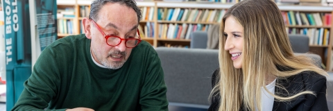 a teacher and student talking 