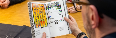 academic looking at a graphioc design book