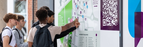 Visiting students looking at large campus map to help navigate  - Open Day 2023
