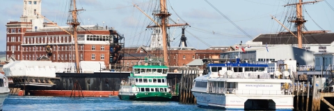 Portsmouth Harbour with historic dockyard ships and ferries