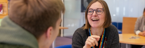 A Careers Advisor with a student, smiling 