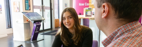 A Careers adviser speaking to a student