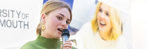 Student running a startup giving speach