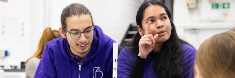 Two University of Portsmouth outreach officers at a college event