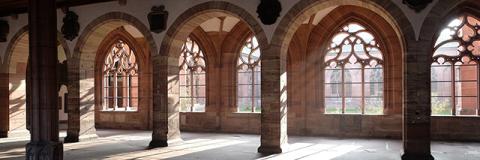 Classic interior architecture with arches, pillars and sunlit windows