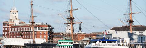 HMS warrior and gosport ferry docked in portsmouth